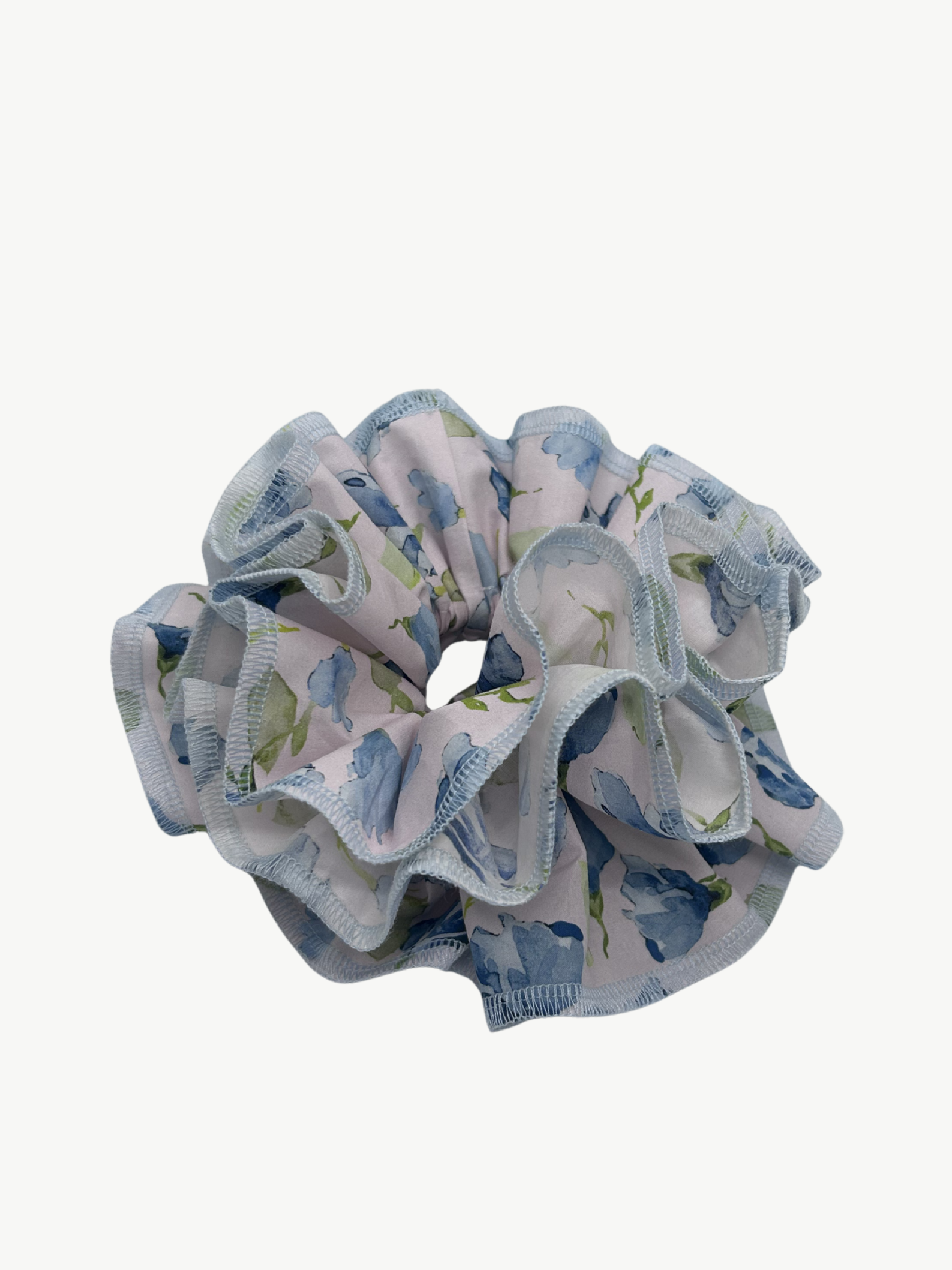 floral blue and light pink hair scrunchie on a white background
