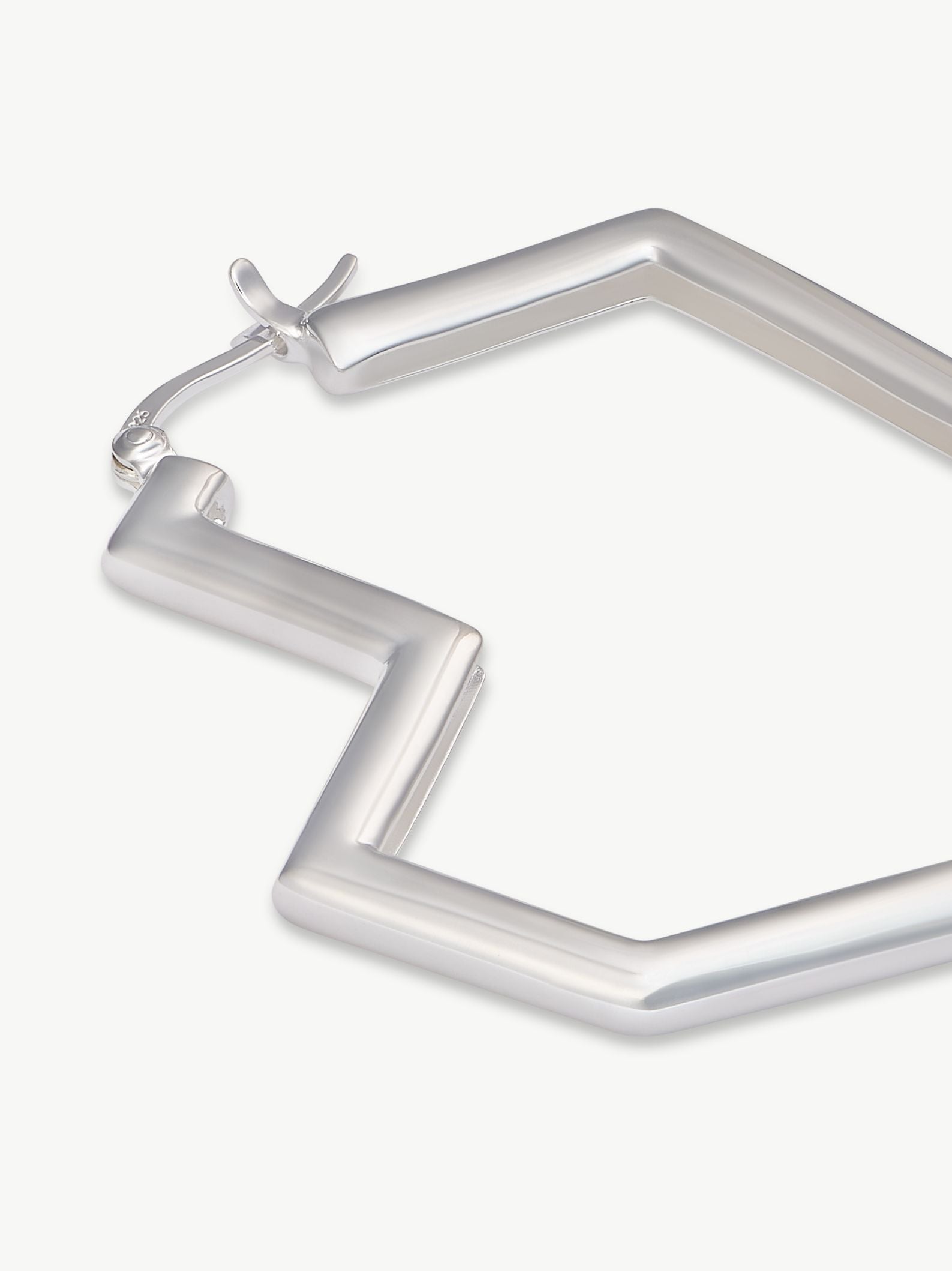 Silver hoop earrings on a white background