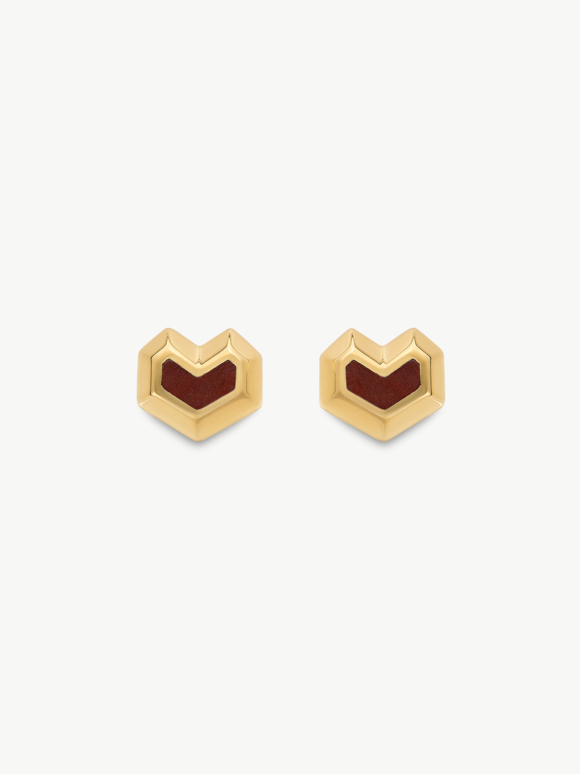 Gold heart-shaped earrings with tiger eye stone on a white background