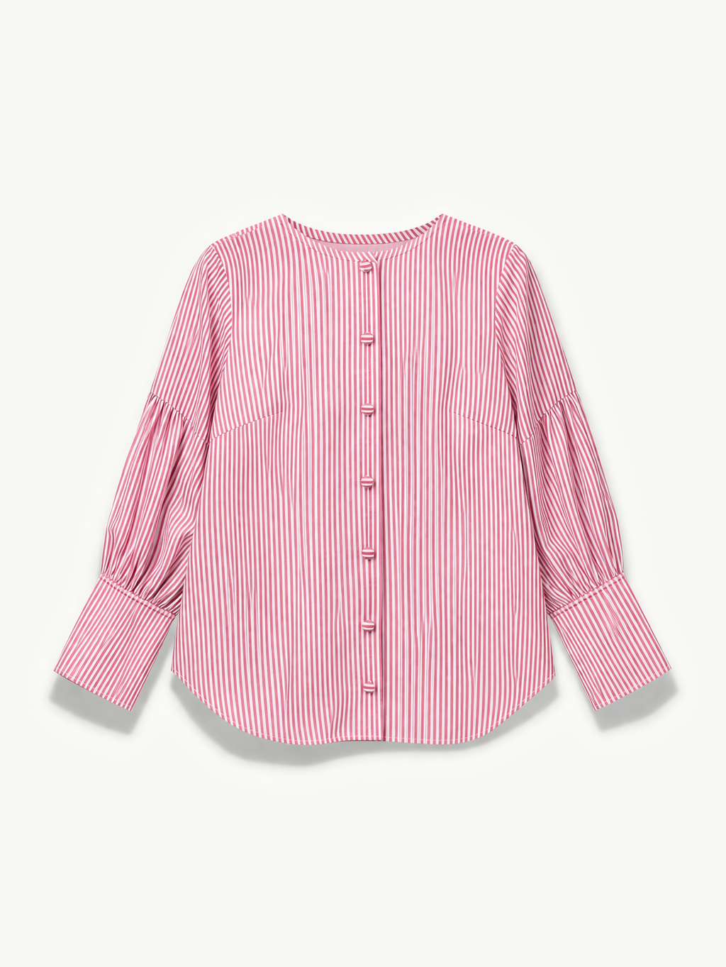 Pink and white striped shirt on a light beige background