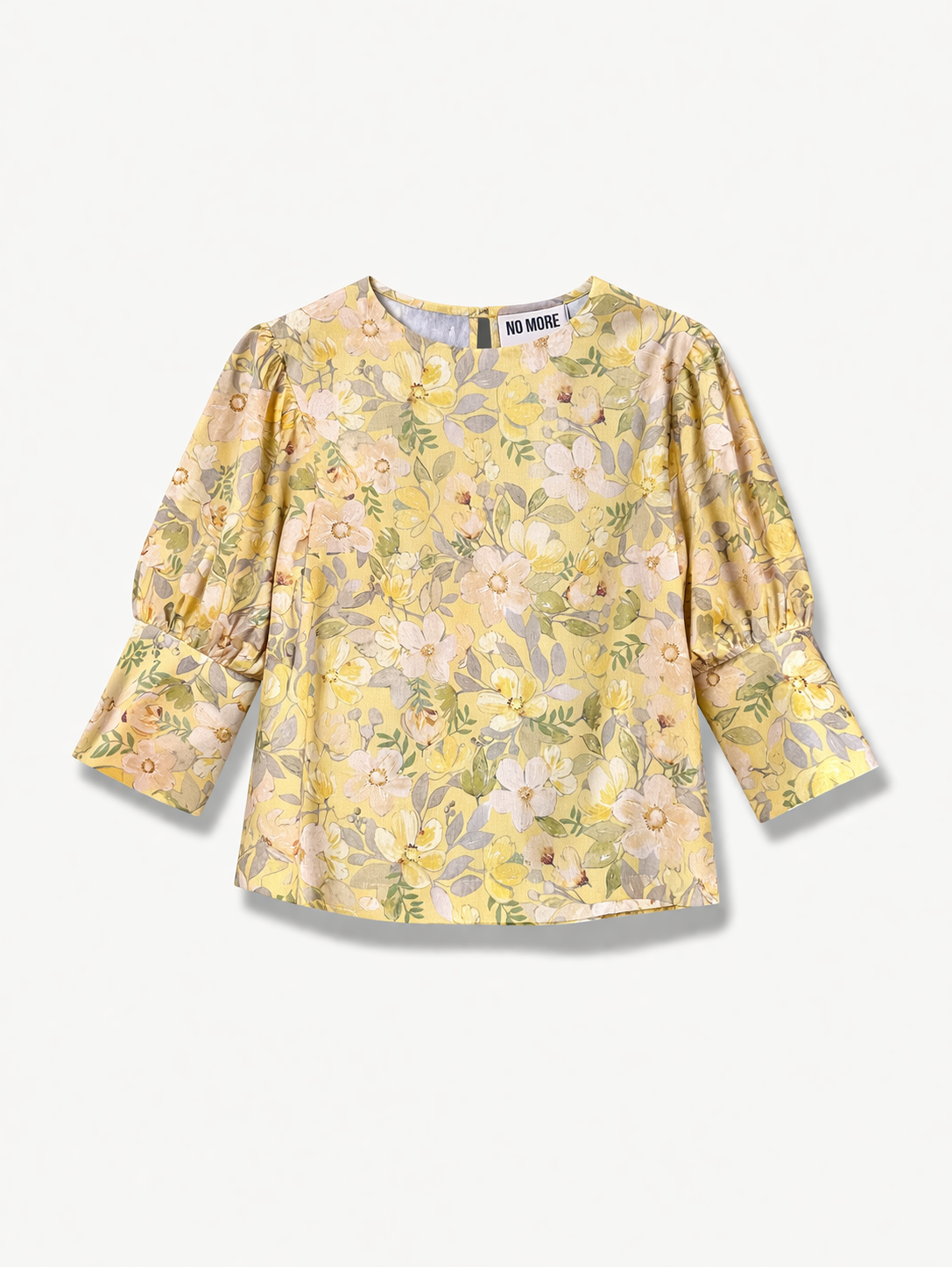Yellow floral blouse with puff sleeves on a white background