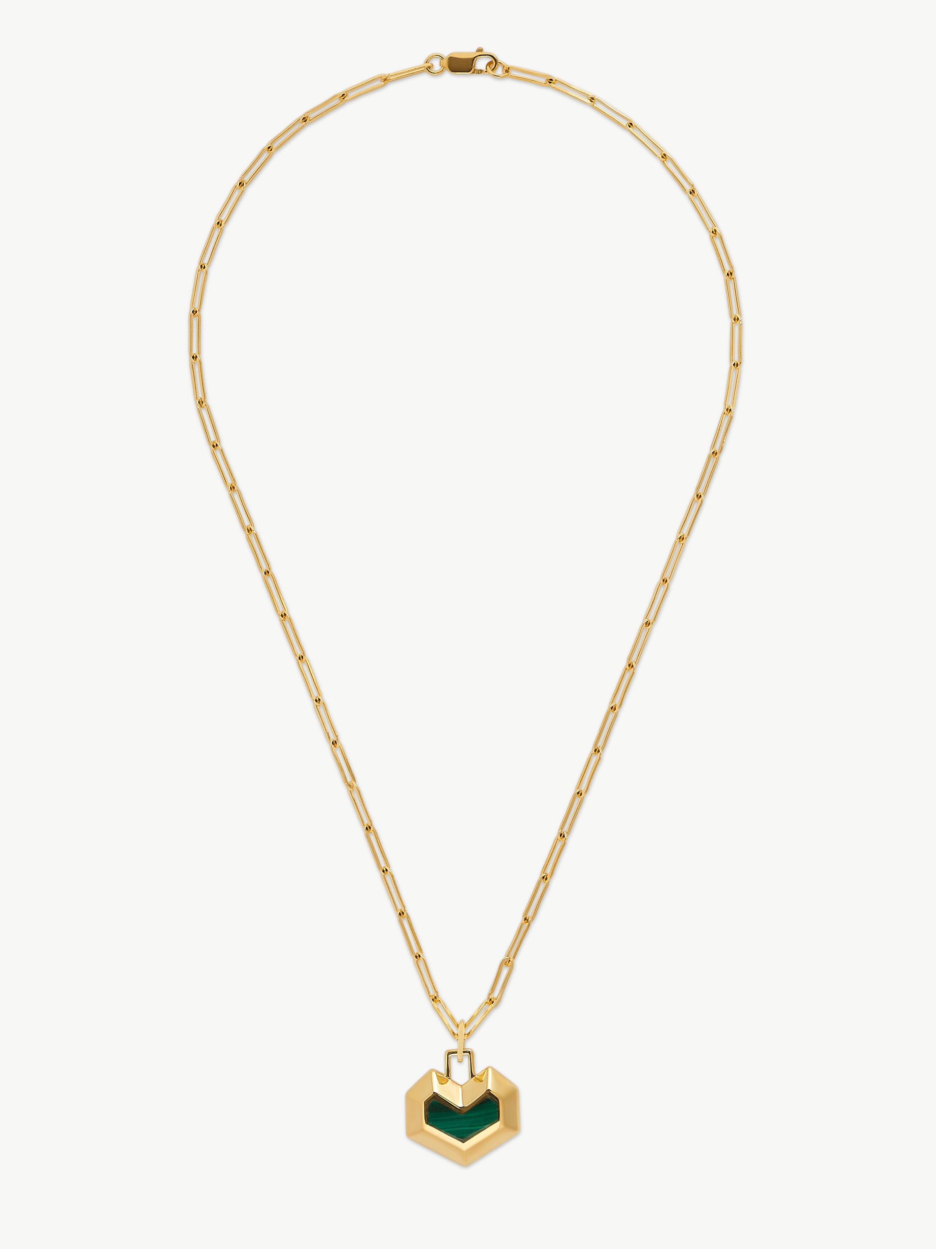 Gold necklace with a green heart pendant on a white background