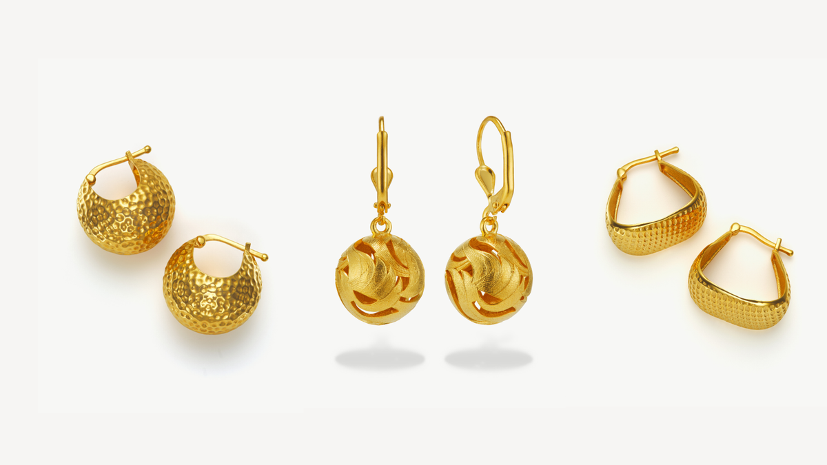 three pairs of gold earrings