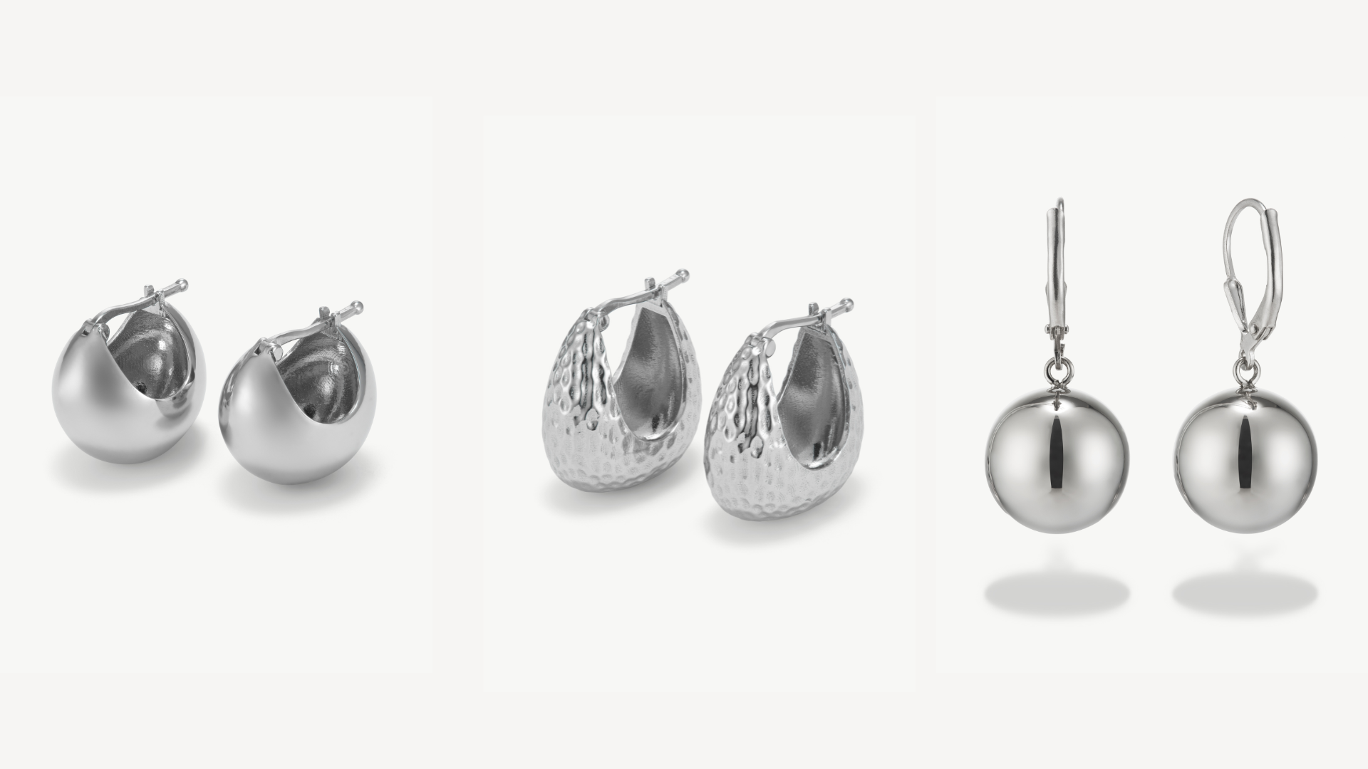 three pairs of silver hoops earrings