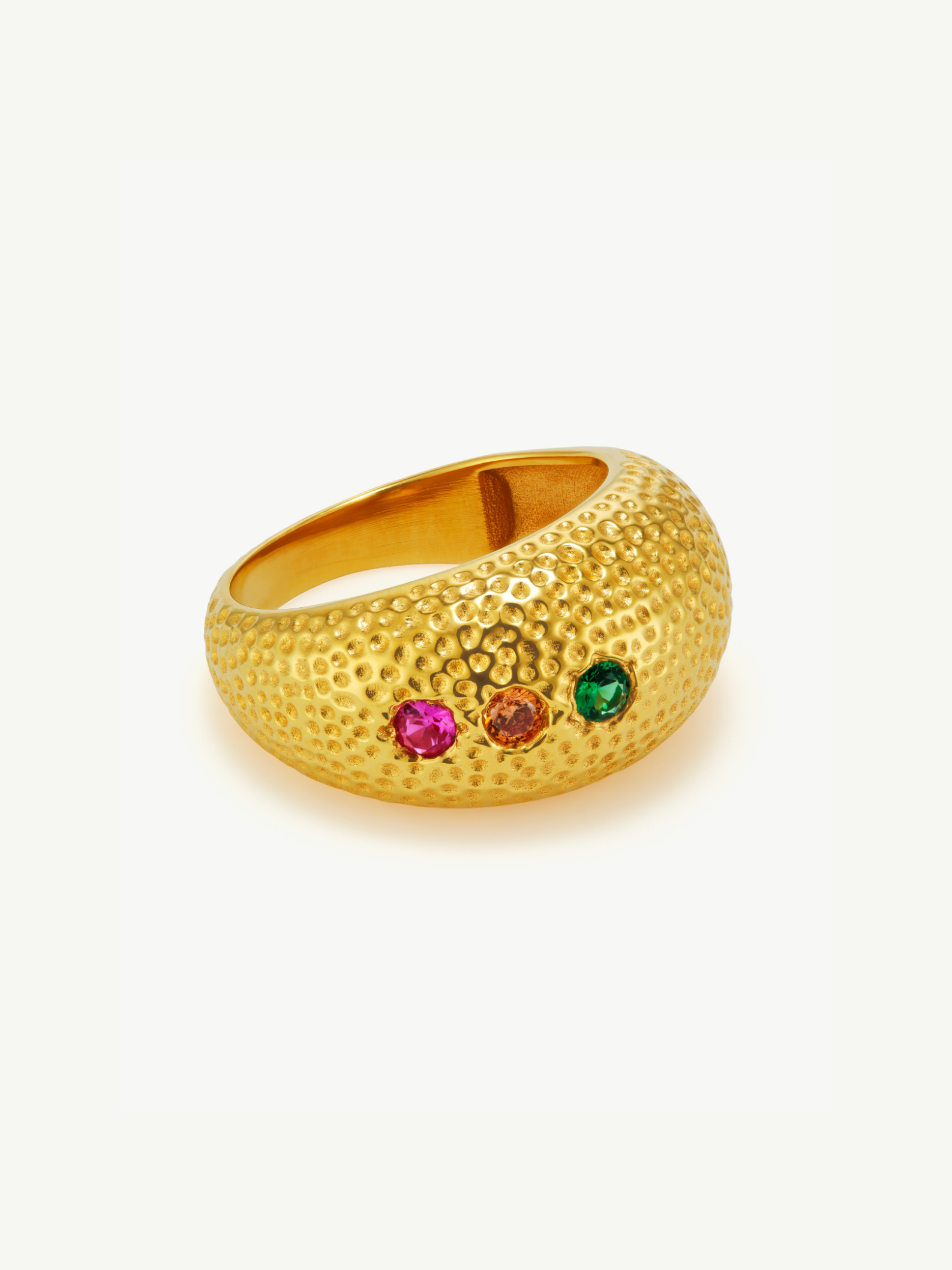 Gold ring with colorful gemstones on a white background