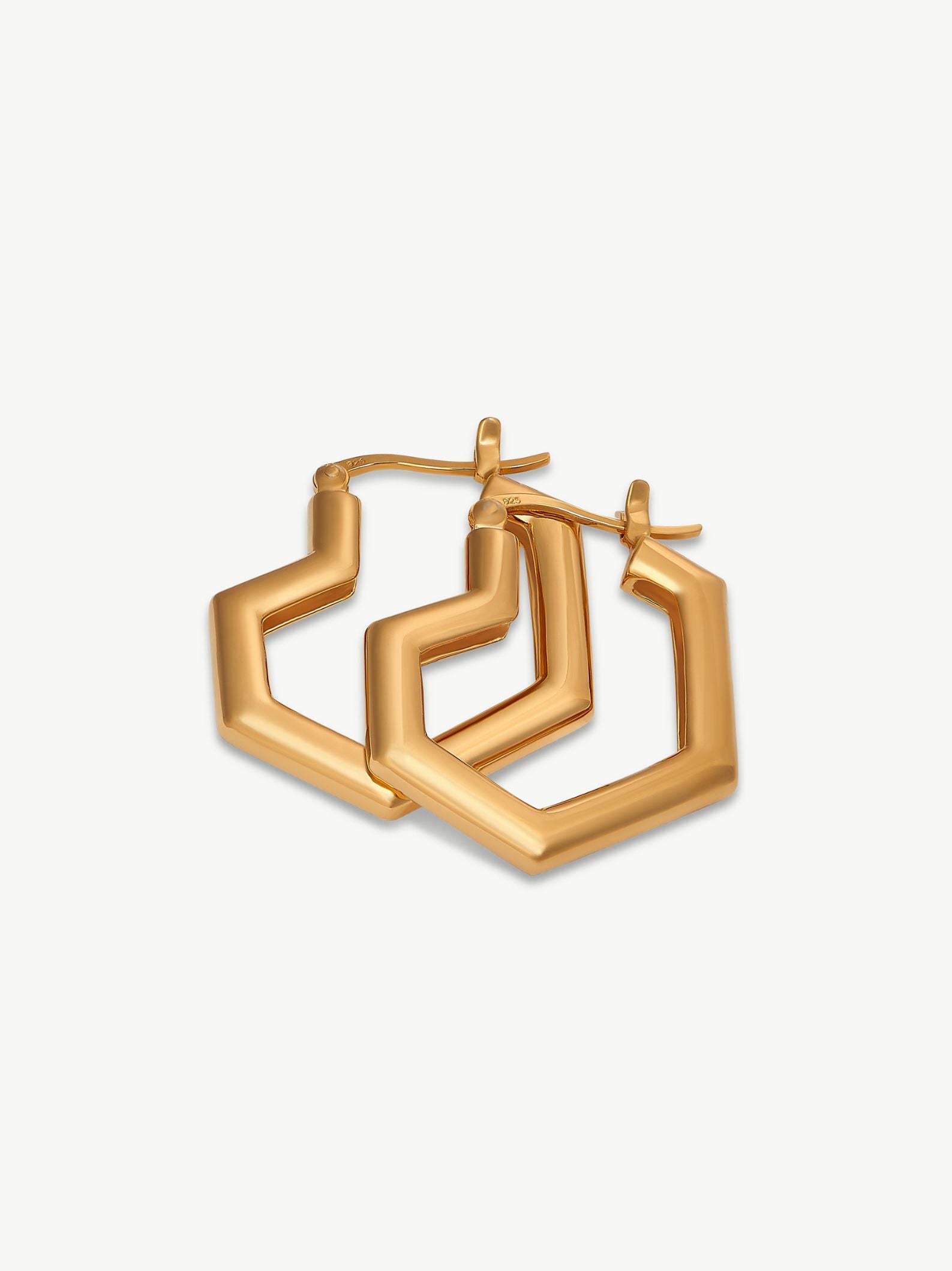 Gold hoop earrings on a white background