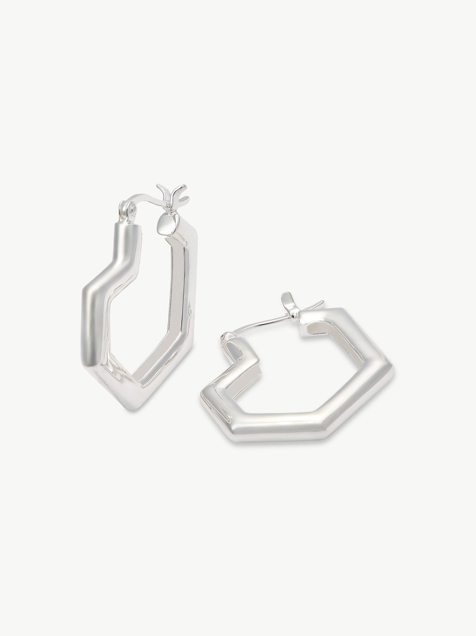 Pair of silver heart hoop earrings on a white background