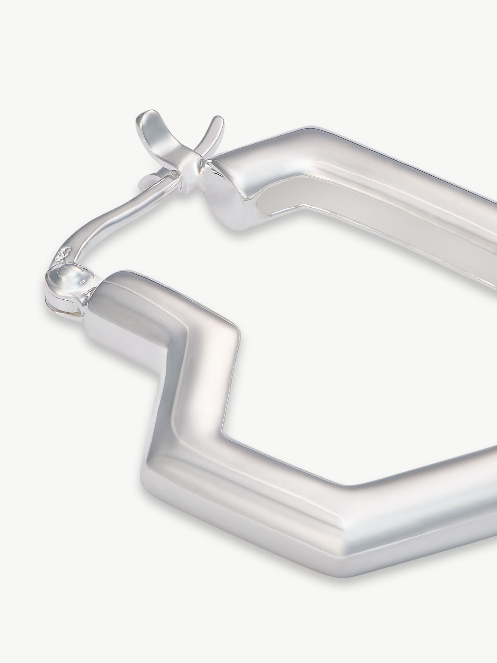 Silver hoop earrings on a white background