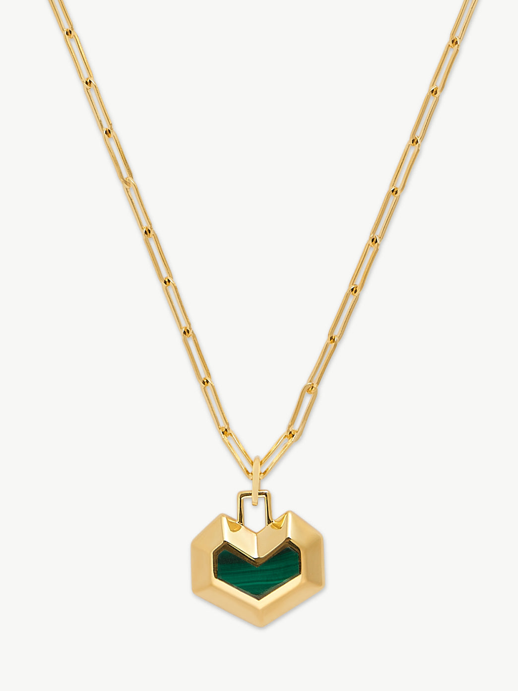 Gold necklace with a green heart-shaped pendant on a white background